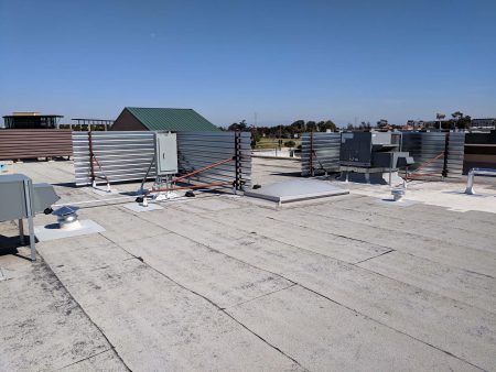 B deck equipment screen on cap sheet rooftop back view